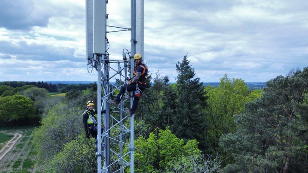 Mitie staff climbing a telecoms tower